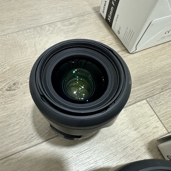 sigma lense 35mm F1.4 + backpack, docking station - Picture 2 of 3